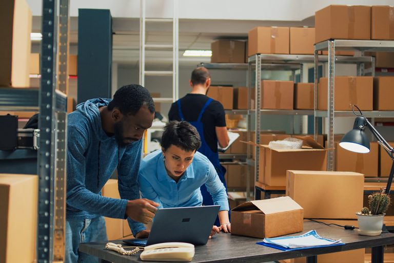 Two employees working in a warehouse